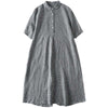Front view of a grey plaid short sleeve midi dress with a button-up collar.