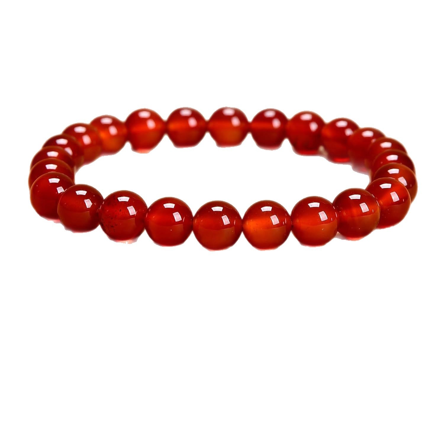 Close up view of a red faceted bead bracelet on a white background