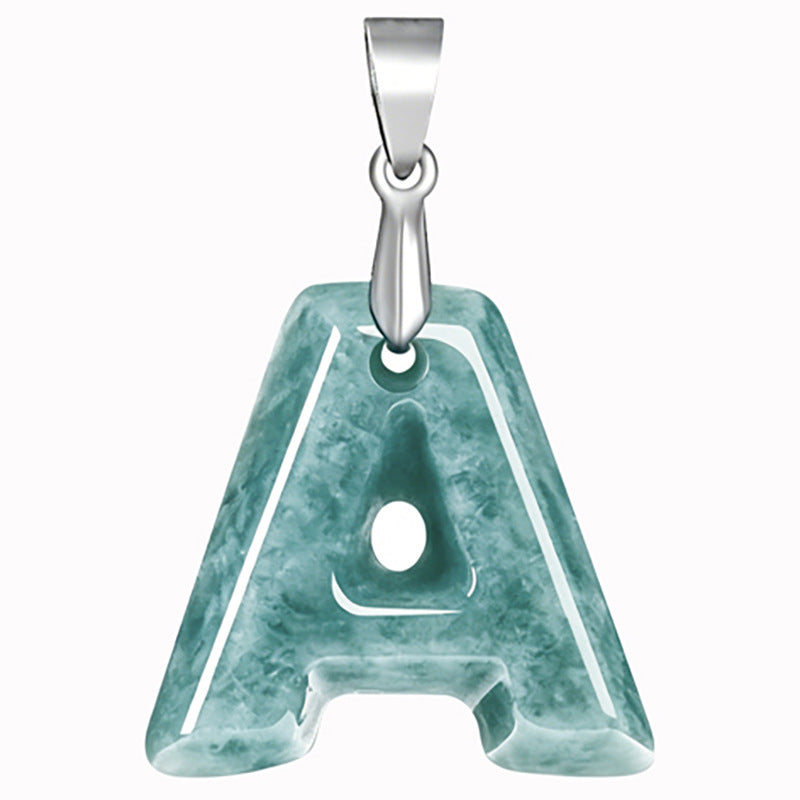 Polished blue-green jade letter pendant hanging on a silver-tone chain against a white background
