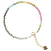 Close up of a thin multi-colored crystal bracelet on a wrist