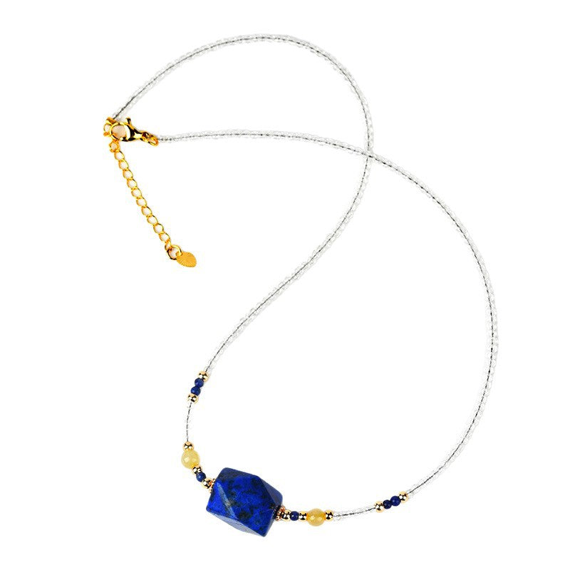 Geometric blue lapis lazuli pendant on a clear quartz beaded necklace