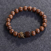 Close up of golden silk sandalwood bracelet with square accent bead