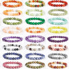 A collection of colorful natural stone beaded bracelets arranged in rows