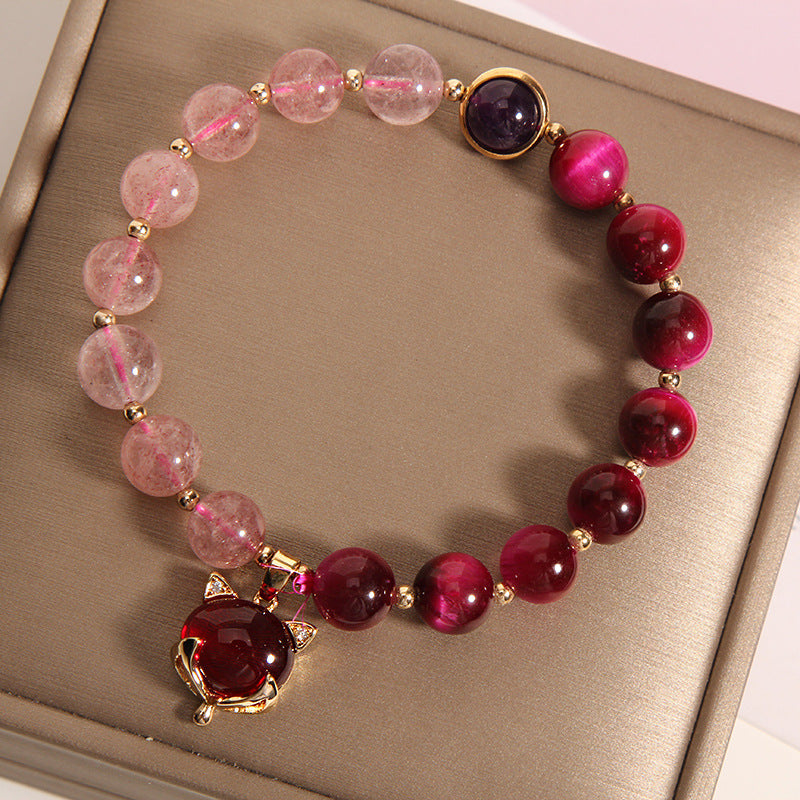 Pink strawberry quartz and red tiger eye beaded bracelet with a gold fox charm