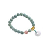 A silver-tone chain bracelet with colorful beads and a white circular charm