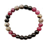 A bracelet made of multi-colored natural stone beads on a white background