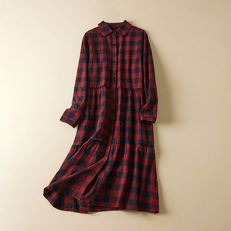 Front view of a long sleeve plaid midi dress with buttons and pockets