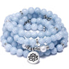 Light blue 108 bead mala bracelet with a silver lotus charm
