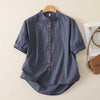 Blue plaid women's short sleeve shirt with mandarin collar and colorful buttons