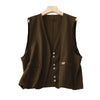 Three solid color sleeveless vests with V-necks and buttons displayed on a neutral background