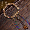 Carved Bone Bead Bracelet with Tassel Charm