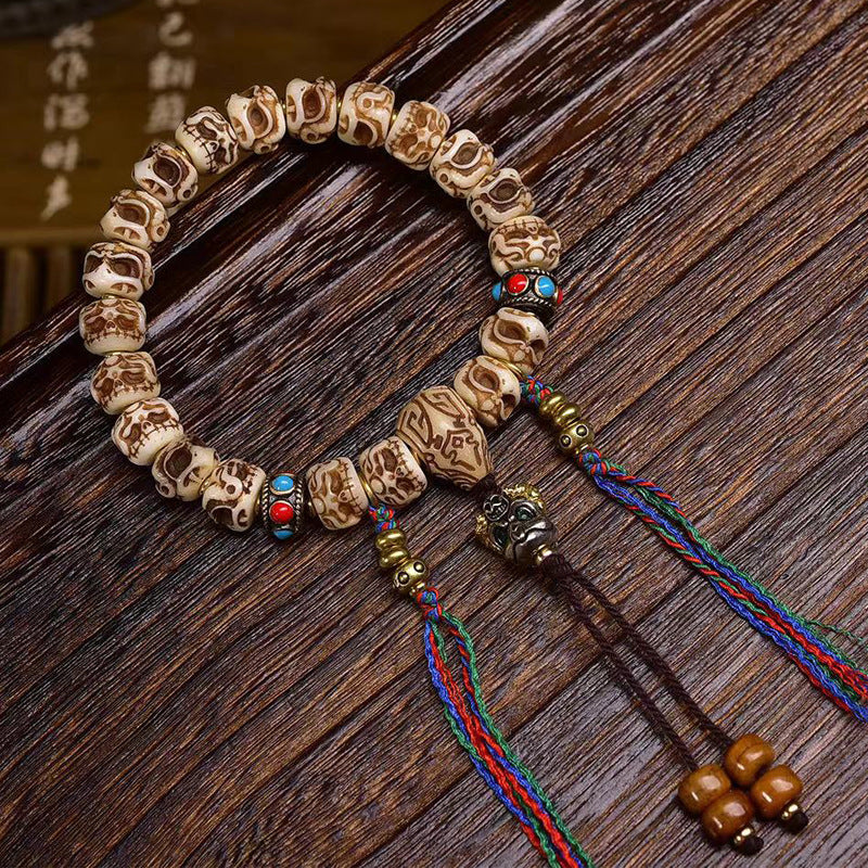 Carved Bone Bead Bracelet with Tassel Charm