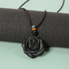 Matte black obsidian rose pendant on a dark brown cord
