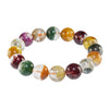 A bracelet made of multicolored natural crystal beads resting on clear blocks