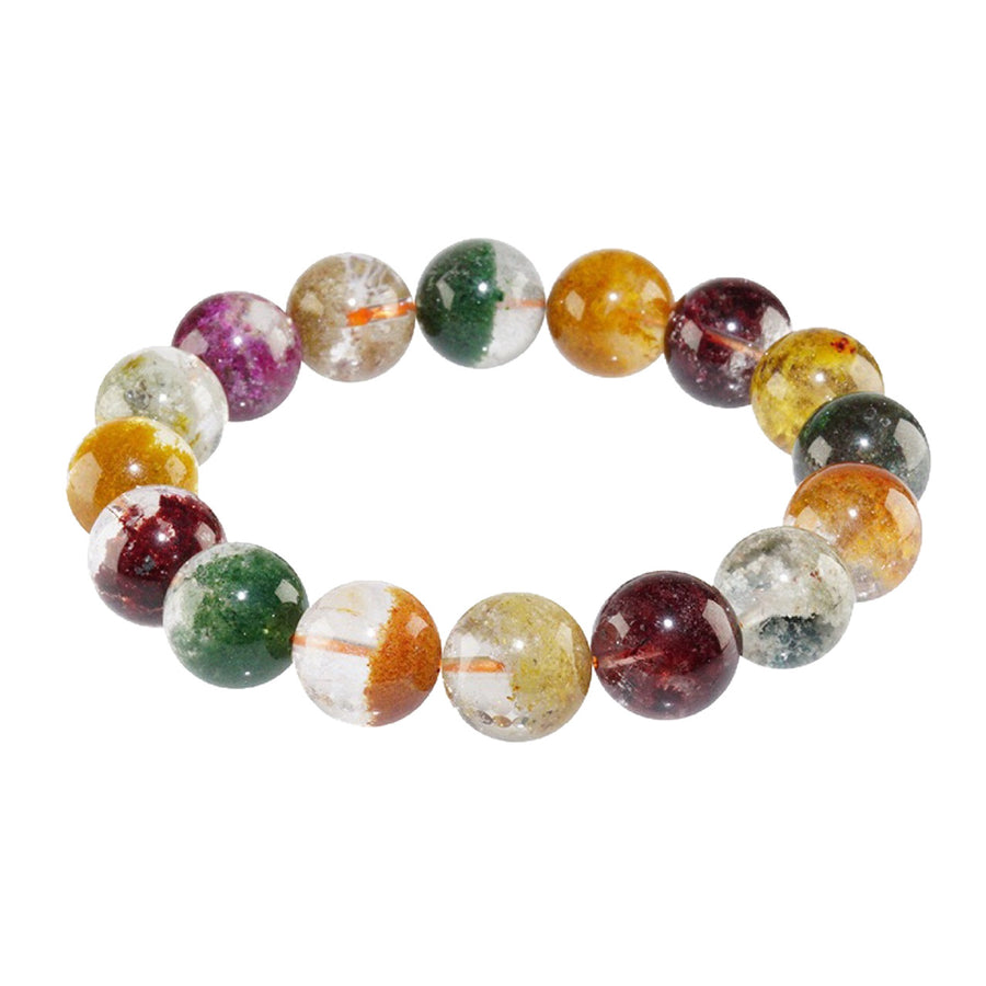 A bracelet made of multicolored natural crystal beads resting on clear blocks