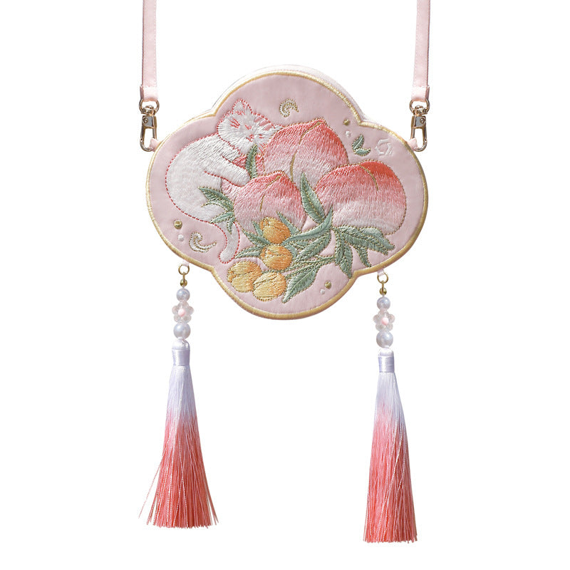 Pink cloud-shaped embroidered bag with a white cat and peach design
