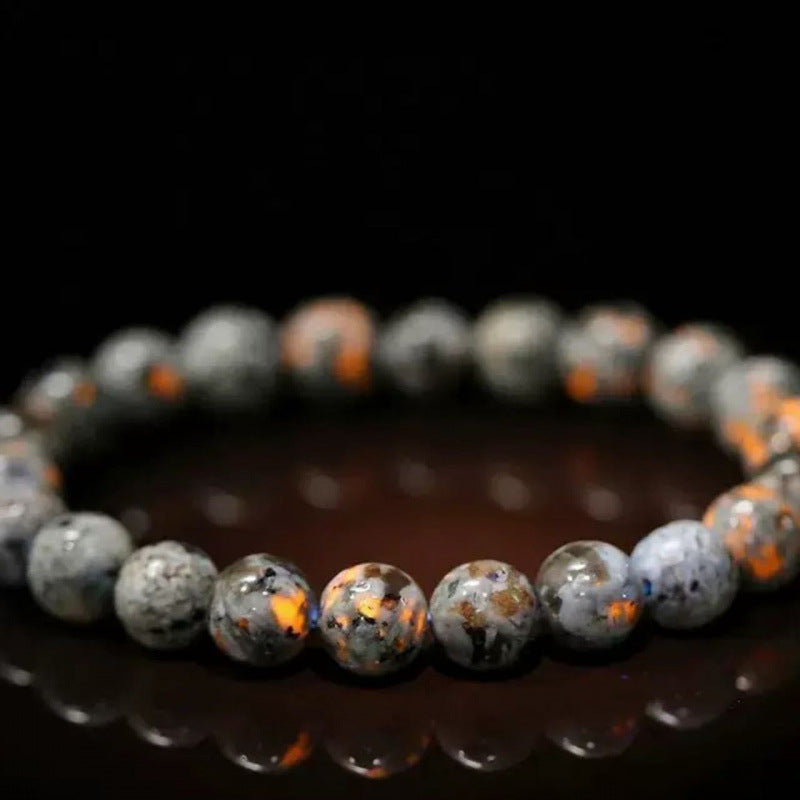 Close up of a natural stone beaded bracelet on a white background