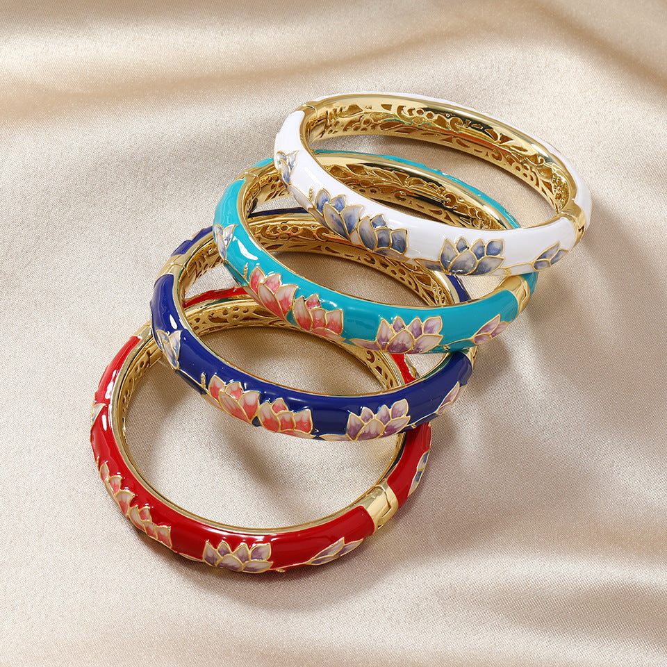Four cloisonné enamel bangles with floral designs in different colors