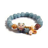 Light blue beaded bracelet with a colorful ceramic lucky cat charm and gold accents