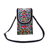 Small black canvas crossbody bag with colorful floral embroidery and silver coin details