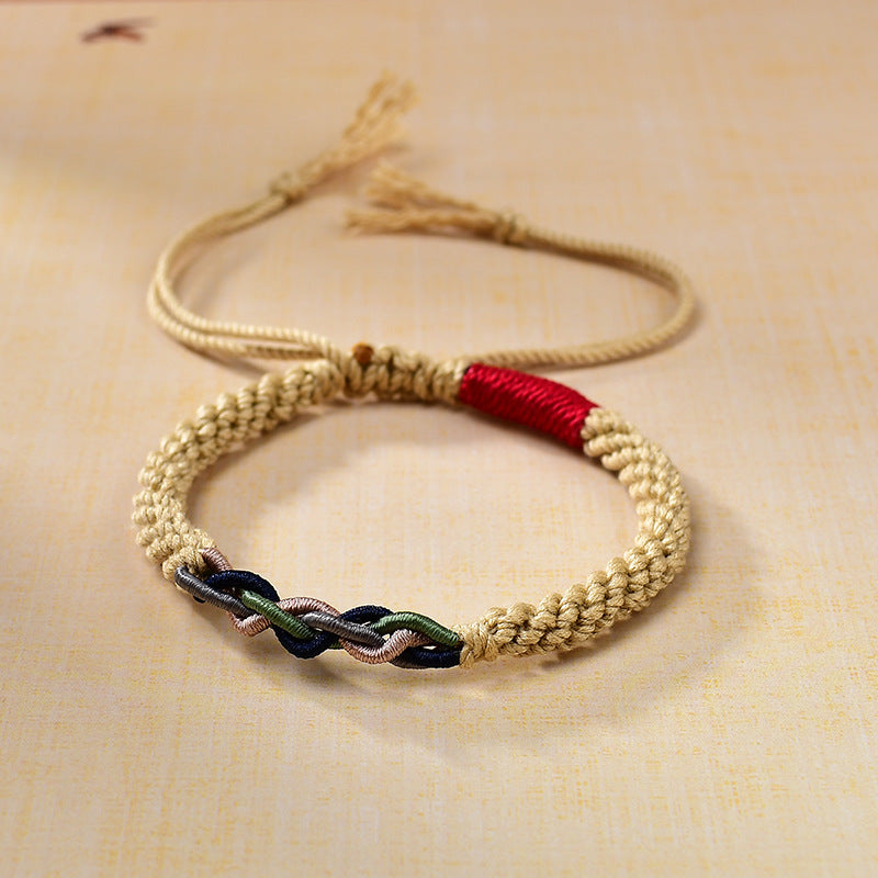 Beige braided rope bracelet with red and multicolor woven accents