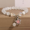 Cat's Eye Charm Bracelet with Flower, Bear and Swan
