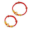 Two red string bracelets with gold horse charms on a white background