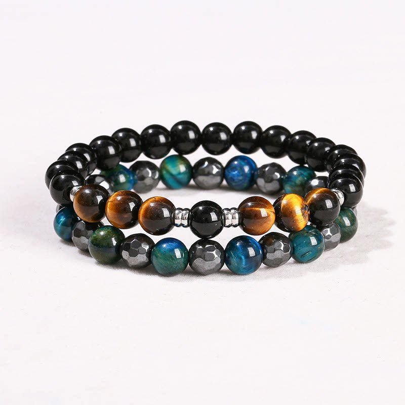 Two stacked beaded bracelets with tiger eye and black obsidian stones