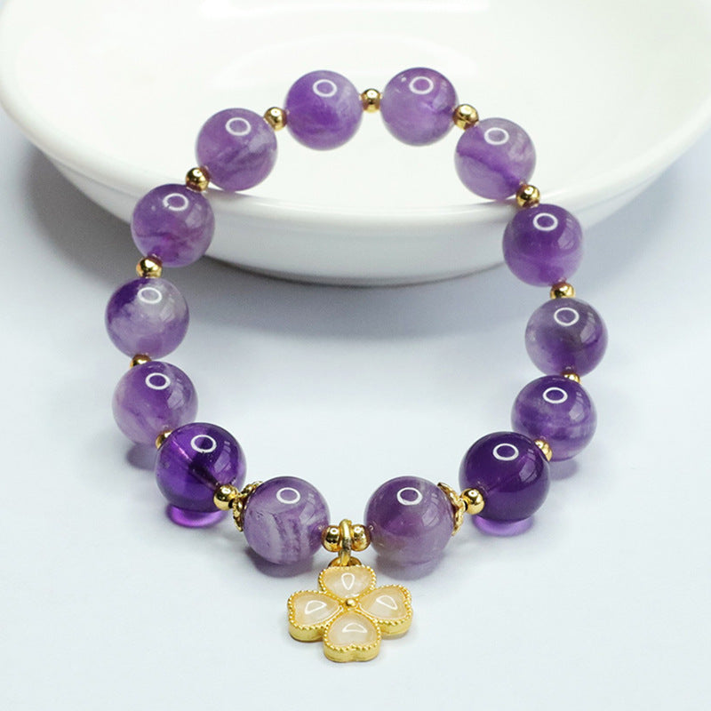 Lavender amethyst beaded bracelet with a gold-tone four leaf clover charm