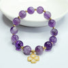 Lavender amethyst beaded bracelet with a gold-tone four leaf clover charm